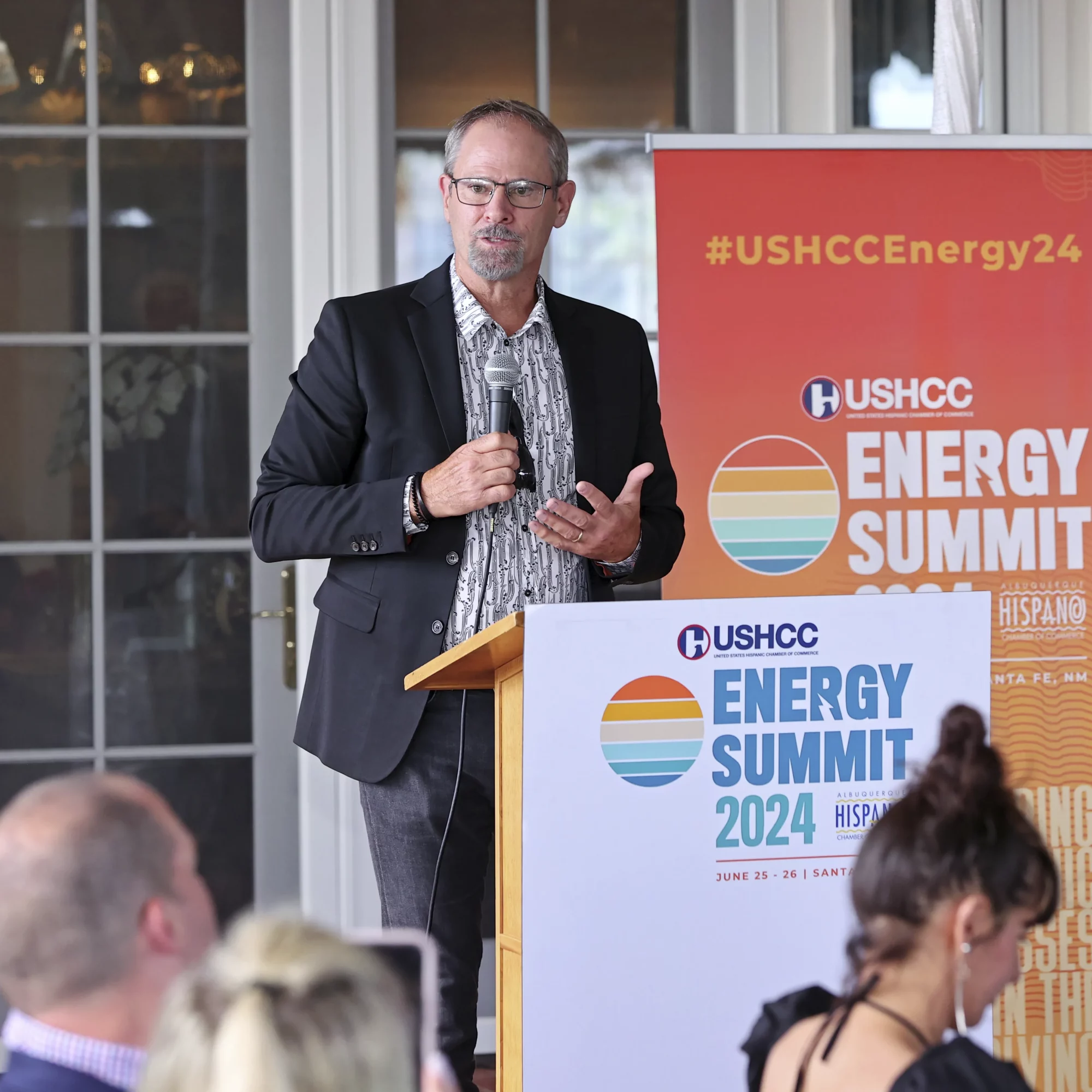 USHCC Energy Conference Attendee Talking into Microphone